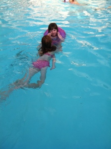 Emma swimming Ally around